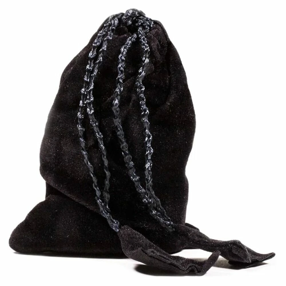 Chakra set van ronde, platte amuletten in zwart zakje